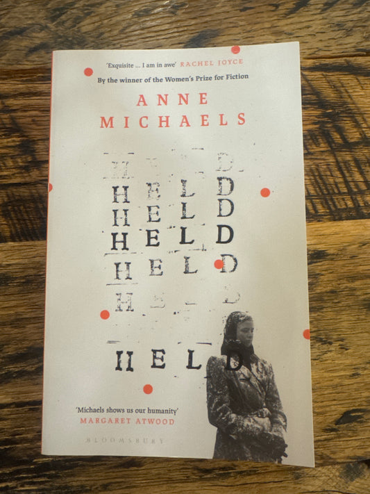HELD by Anne Michaels